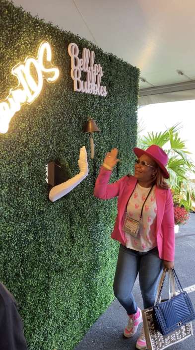 IMG_1470 Woman interacting with the living champagne wall